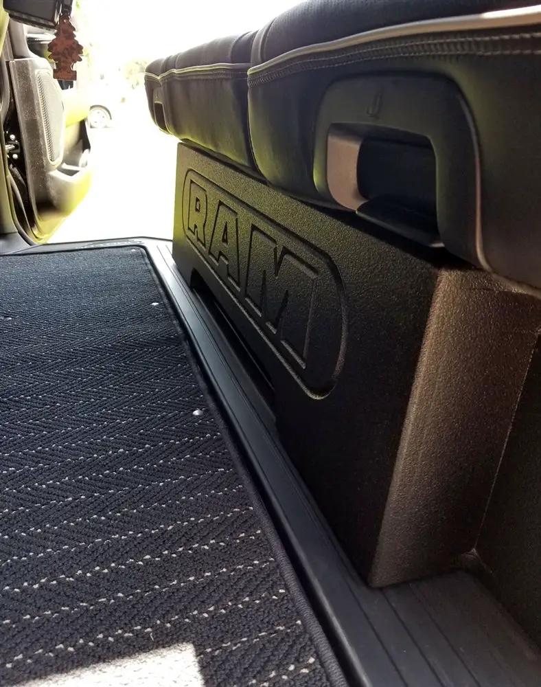 Side view of a RAM-branded enclosure fitted under a rear seat beside the door sill