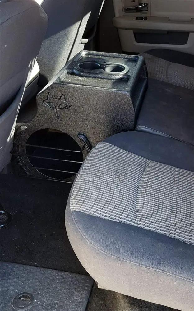 Fox Box Ram quad-subwoofer enclosure installed behind the front seats with cup holders on top