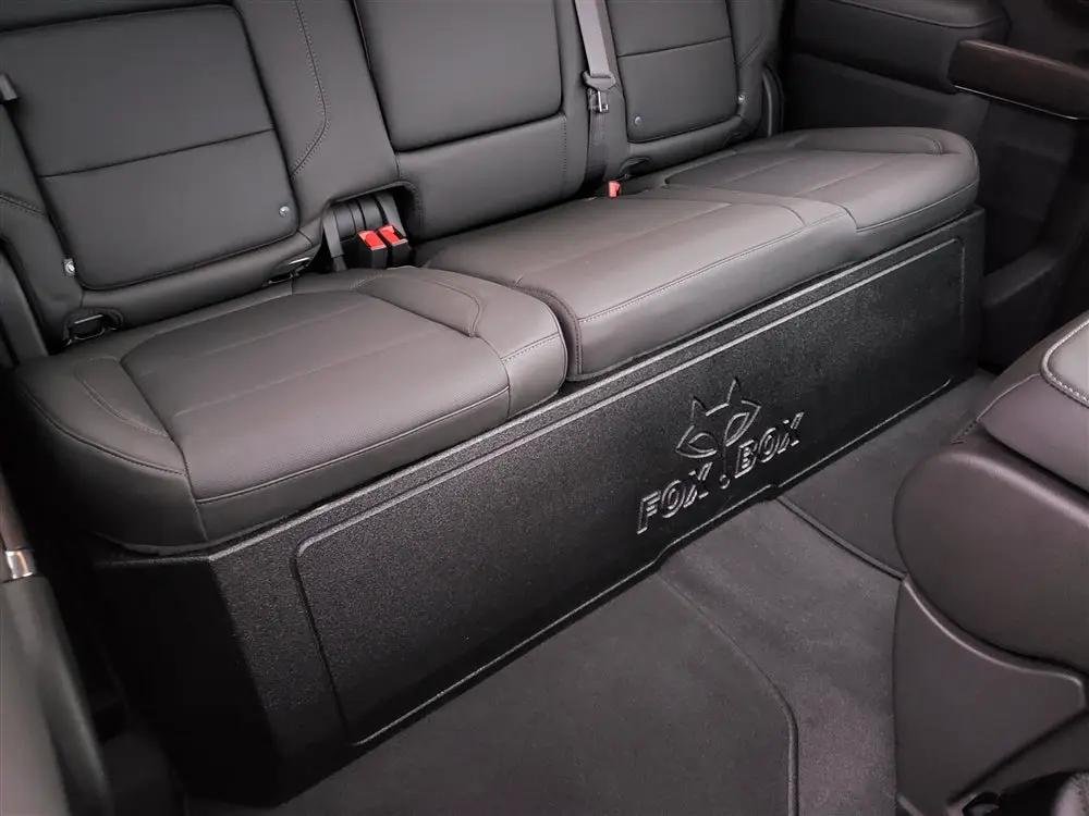 Fox Box enclosure fitted beneath a rear bench seat, with its embossed logo visible on the front