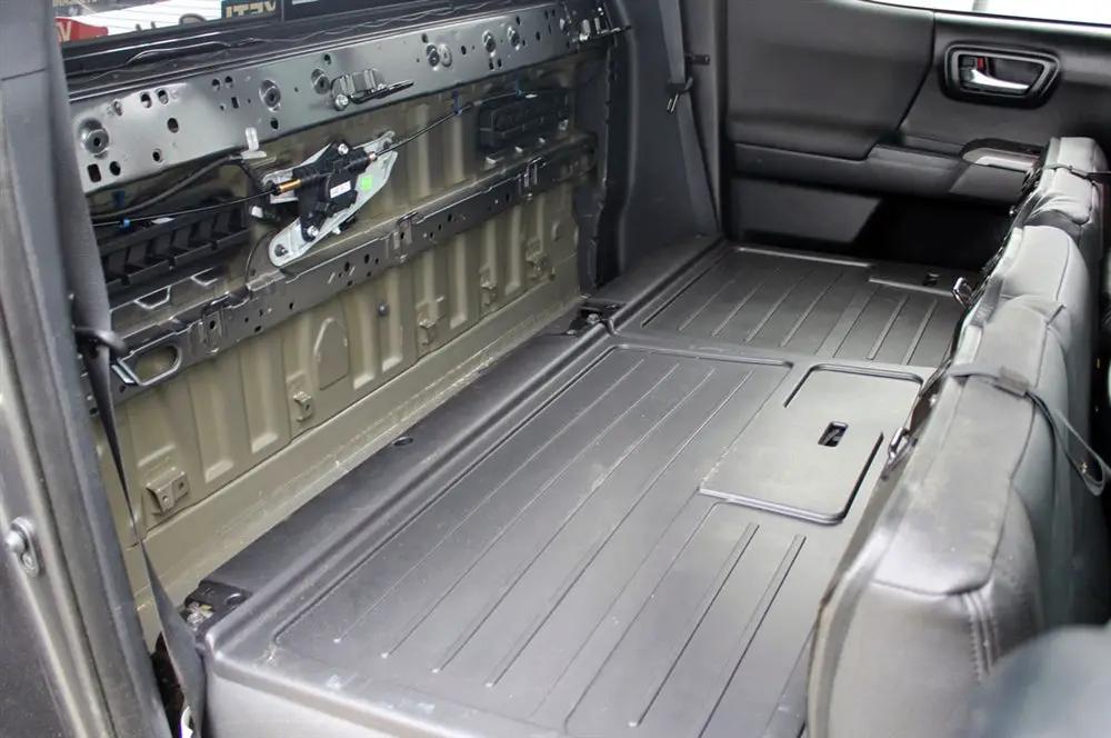 Rear cabin with seat backs folded forward and the rear-wall trim removed