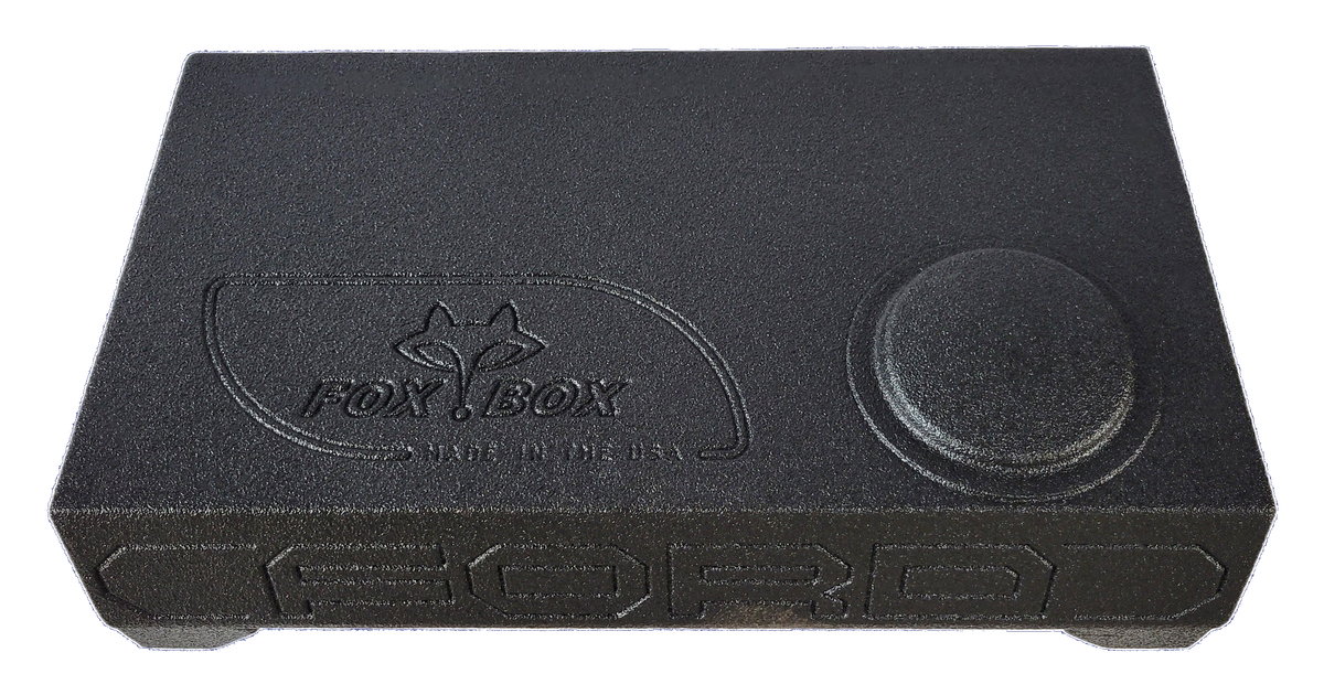 Fox Box enclosure viewed from above, showing the logo and a single raised circular section