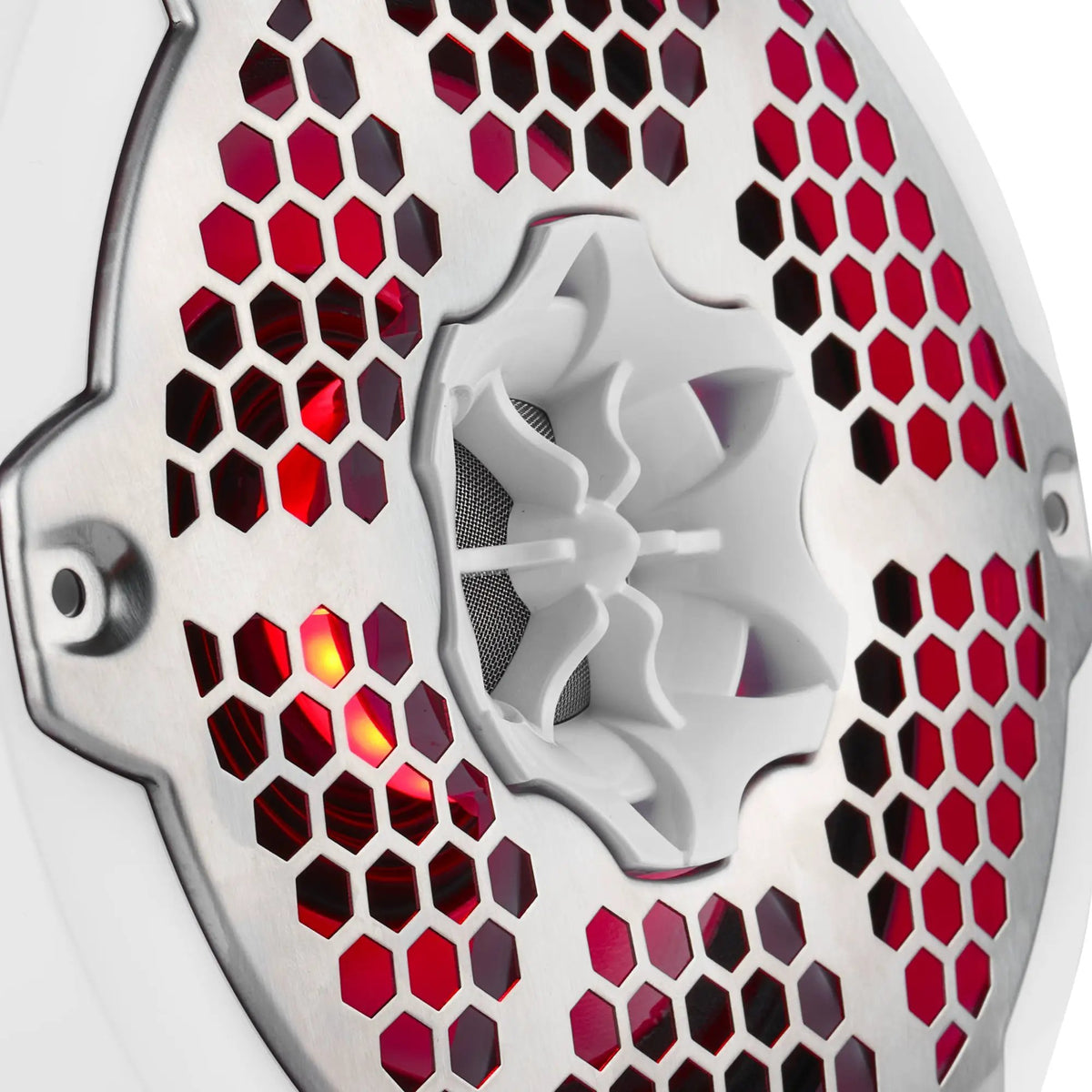 Close-up of a white speaker's central tweeter, silver honeycomb grille and red lighting