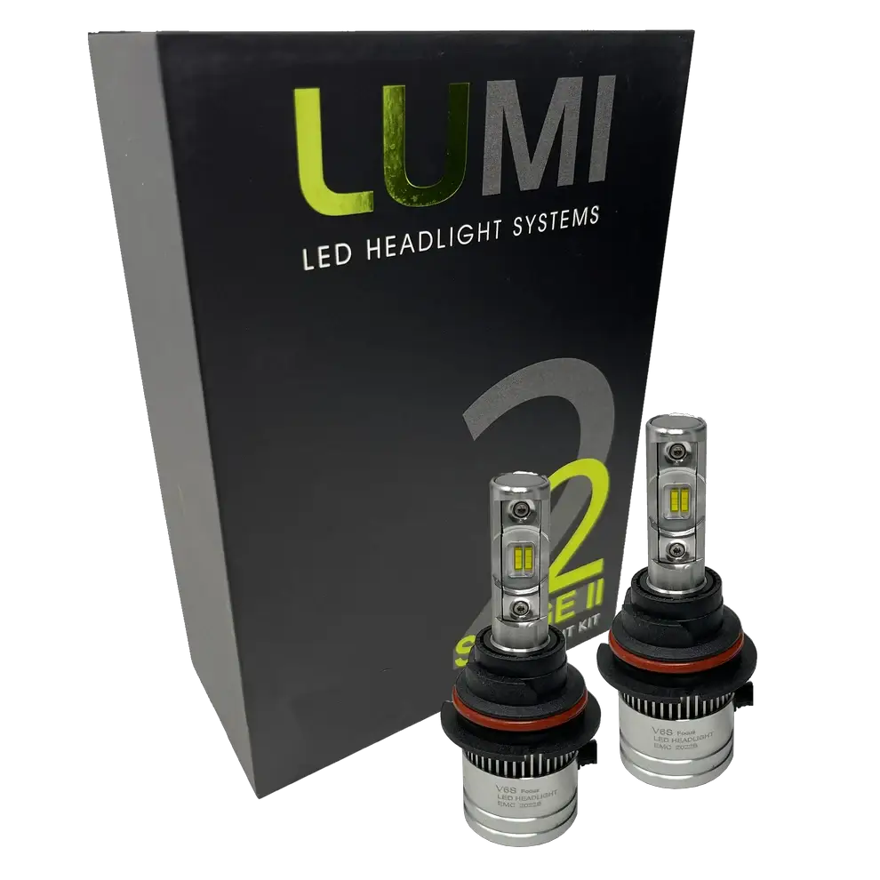 Two LUMI Stage 2 9006 LED Headlight Bulbs by Lumi, featuring advanced CSP chips and metallic bases with visible LED elements, are displayed in front of a black box labeled “LUMI LED Headlight Systems 2 Series II.†These bulbs deliver a crisp 6000K white light.