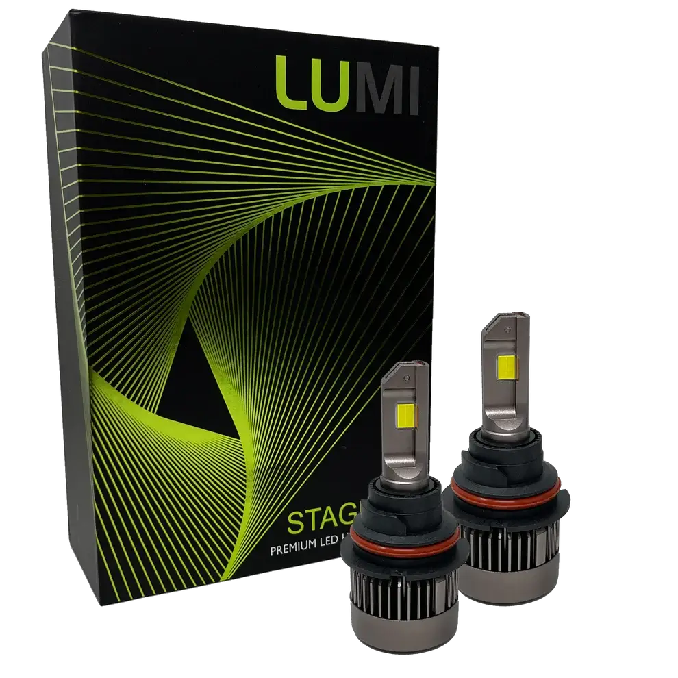 Two LUMI Stage 3 9007 LED Headlight Bulbs with advanced CSP chips and a bright 6000K color temperature are shown in front of a black Lumi box accented with green lines and the text “STAGE PREMIUM LED.â€.