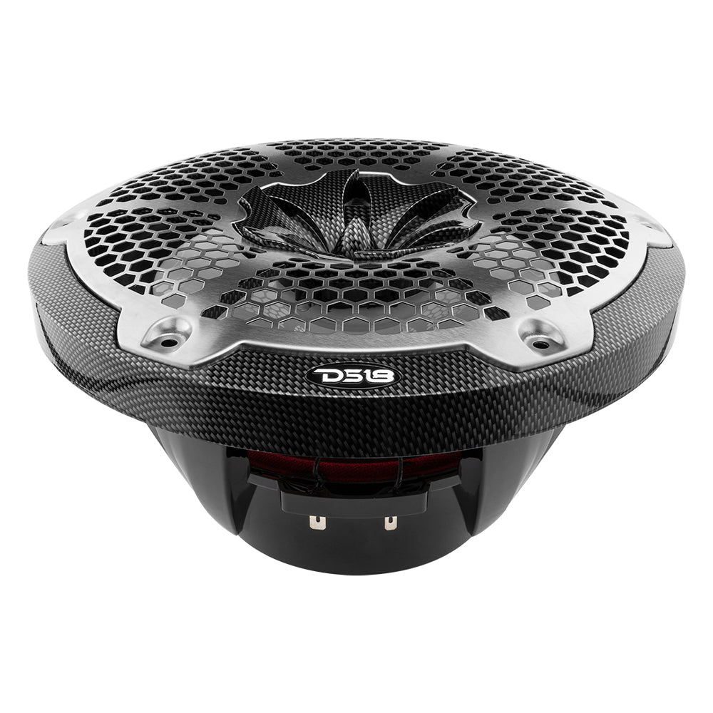 Low-angle view of a carbon-fiber-pattern DS18 speaker showing honeycomb grille and basket terminals