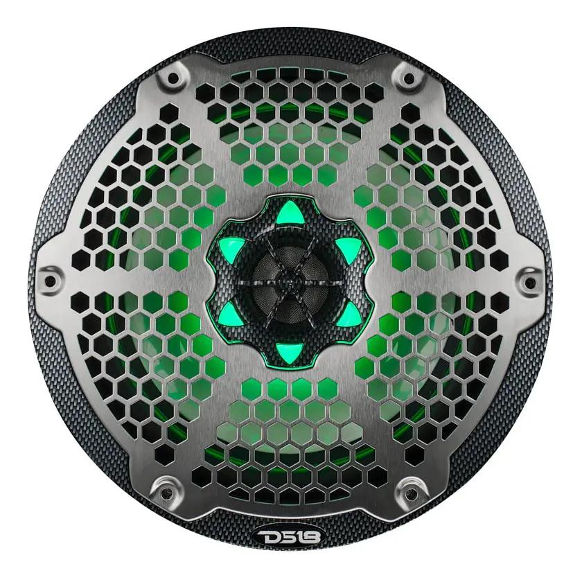 Front view of a DS18 speaker with a silver honeycomb grille, carbon-fiber-patterned rim and green lighting.