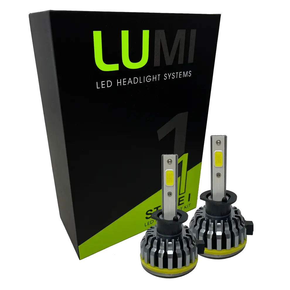 Two LUMI Stage 1 H1 LED Headlight Bulbs are displayed in front of a black and green Lumi box labeled “Stage 1 LED Headlight Kit,†featuring a powerful 40-watt output and a crisp 6000K color temperature for superior visibility.