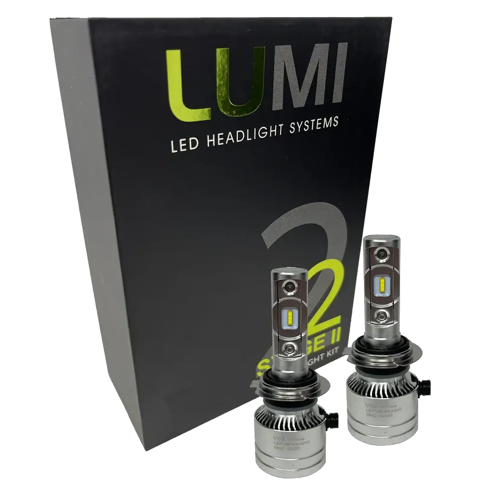 Two LUMI Stage 2 H7 LED Headlight Bulbs from Lumi, featuring advanced CSP chips, are displayed in front of a black box labeled “LUMI LED Headlight Systems S2 Stage II Headlight Kit†on a white background, providing bright 6000K illumination for superior visibility.