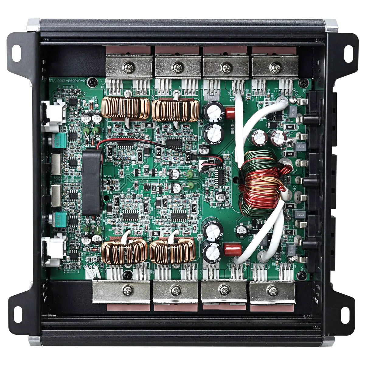 Open amplifier chassis showing a green circuit board, copper coils and internal wiring