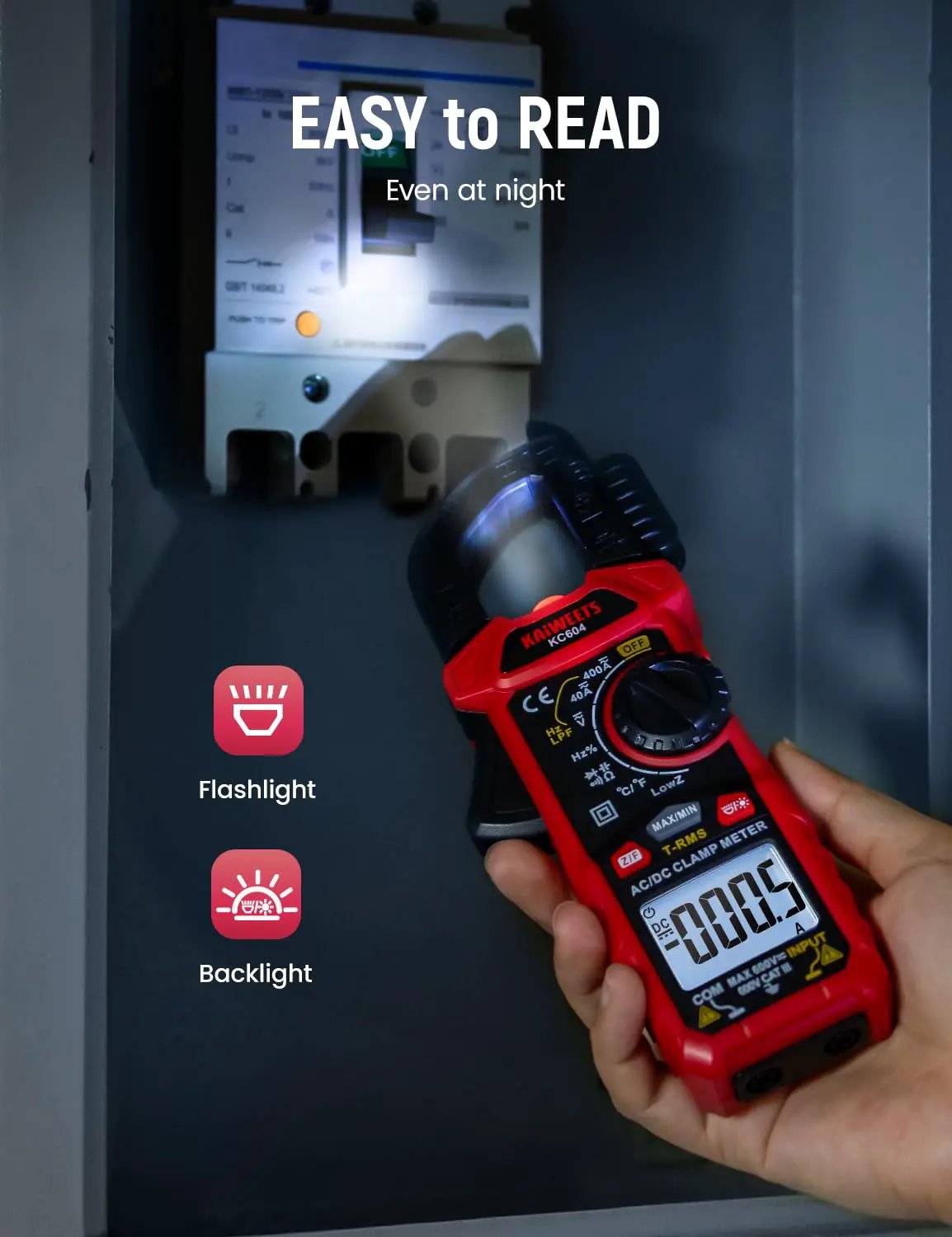 KC604 clamp meter with illuminated display and flashlight used in a dark electrical panel