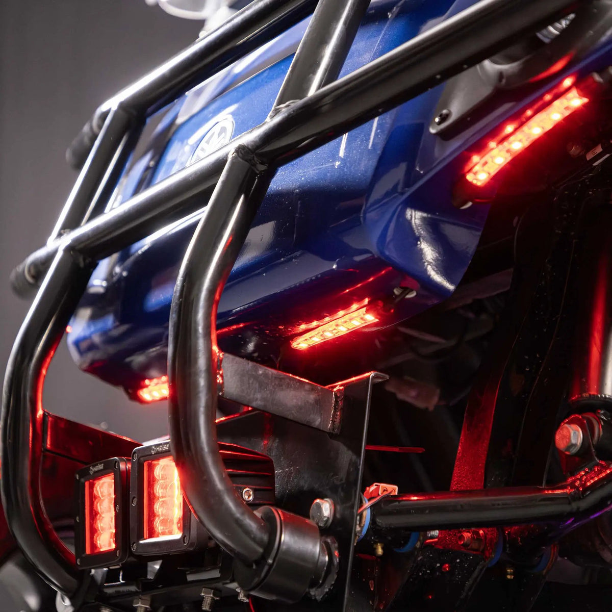Red LED accent strips installed beneath a motorcycle luggage rack