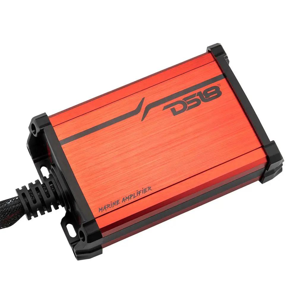 Angled view of a compact red DS18 marine amplifier with an attached cable and mounting slots