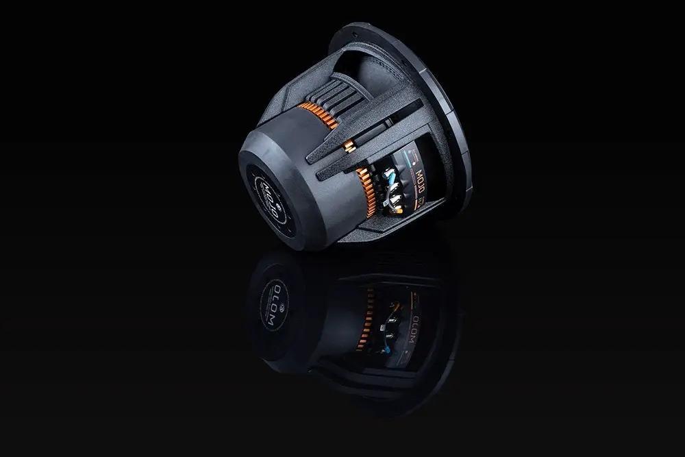 Angled rear of a Memphis MOJO subwoofer, showing its large magnet, open basket and orange vent details