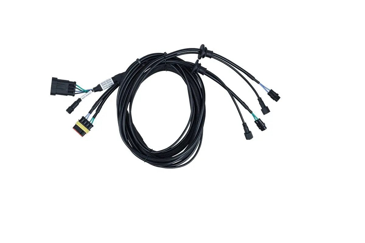 Coiled black wiring harness with several labeled branches and plug connectors