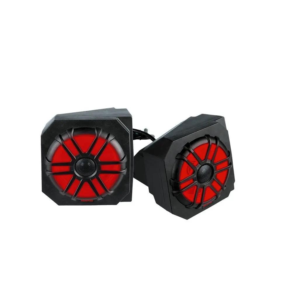 Two angular black speaker pods with red illuminated cones