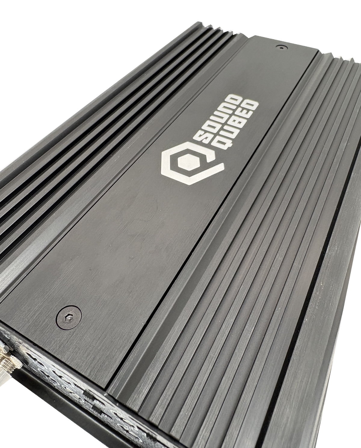 Close angled view of a SoundQubed amplifier's black top panel, white logo and longitudinal cooling fins