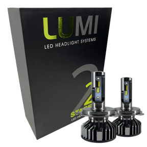 A black box labeled Lumi stands next to two LUMI Stage 2 880 LED headlight bulbs featuring metallic bases and yellow accents, all displayed against a white background.