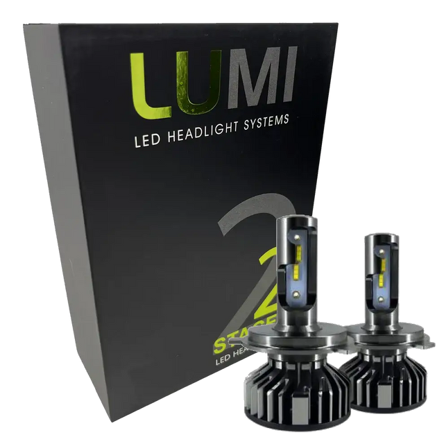 A black box labeled Lumi stands next to two LUMI Stage 2 880 LED headlight bulbs featuring metallic bases and yellow accents, all displayed against a white background.