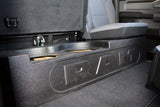 RAM-branded enclosure installed beneath a rear bench seat with one seat cushion raised