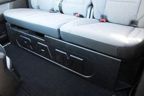 Black RAM-branded enclosure fitted beneath a rear bench seat