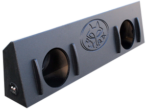 Angled view of a black Fox Box enclosure with two round speaker openings, raised front strips and an end terminal cup