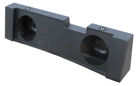 Black enclosure with two round speaker openings, a stepped upper edge and two terminal cups