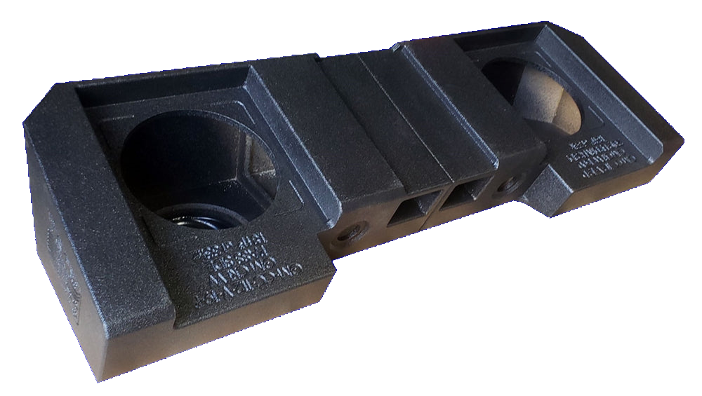 Black subwoofer enclosure with two speaker openings and central vent channels, angled view
