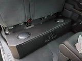 Fox Box GM enclosure installed under the raised rear seat, with its molded rear surface facing upward