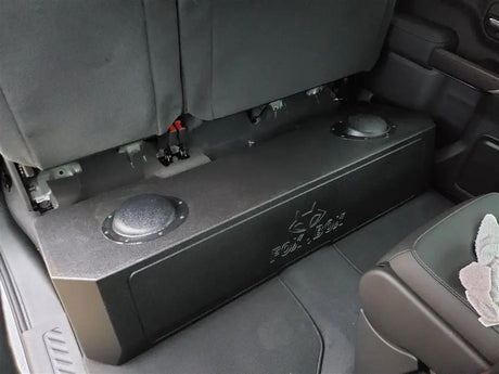 Fox Box GM enclosure installed under the raised rear seat, with its molded rear surface facing upward