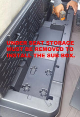 Fox Box Nissan Titan installation photo noting that the under-seat storage tray must be removed before fitting the enclosure