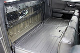 Rear cabin with seat backs folded forward and the rear-wall trim removed