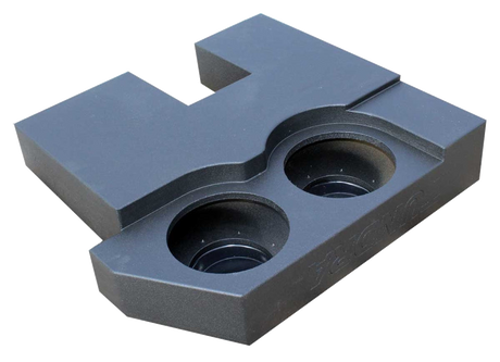 Underside view of a black subwoofer enclosure with two recessed round speaker openings