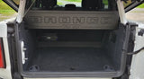 Ford Bronco cargo-area view showing the Fox Box enclosure behind the rear seats and an amplifier below it
