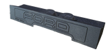 Fox Box enclosure with FORD lettering and two raised circular sections, angled front view