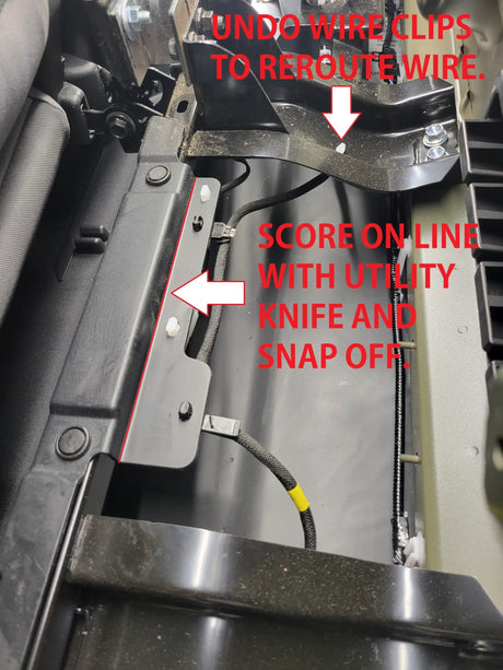 Installation diagram marking wire clips to release and a trim section to score and remove