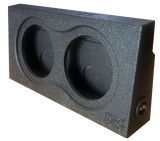 Black textured subwoofer enclosure with two recessed circular openings and a side terminal cup