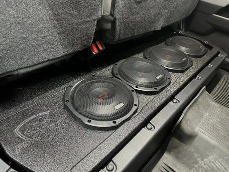 Fox Box Toyota Tundra enclosure installed under the raised rear seat with four subwoofers fitted