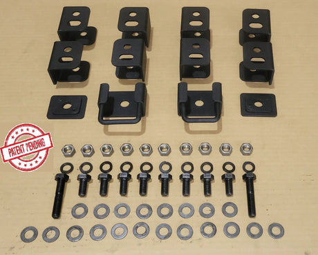 Seat-lift brackets, spacers, bolts, nuts and washers arranged in rows