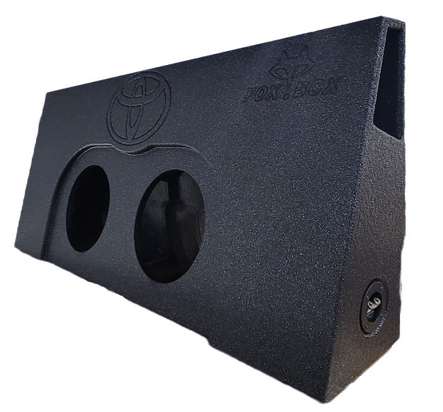 Wedge-shaped subwoofer enclosure with two speaker openings, a Toyota emblem and side port