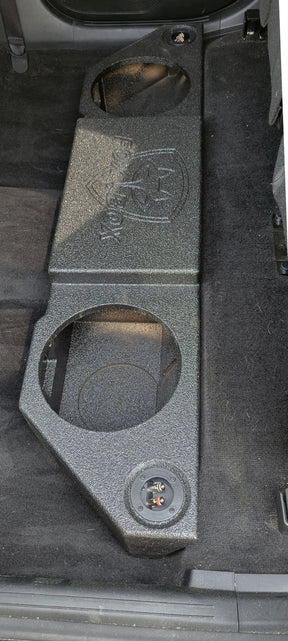 Overhead view of a Fox Box enclosure with two empty speaker openings fitted on the rear cabin floor