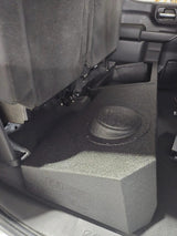 FOX BOX enclosure beneath a raised rear seat, showing the raised speaker section beside the storage area