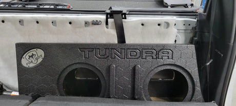Front view of a Fox Box TUNDRA enclosure with two empty speaker openings inside the rear cabin