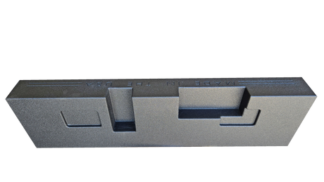 Rear view of a black subwoofer enclosure showing stepped recesses and a small rectangular panel