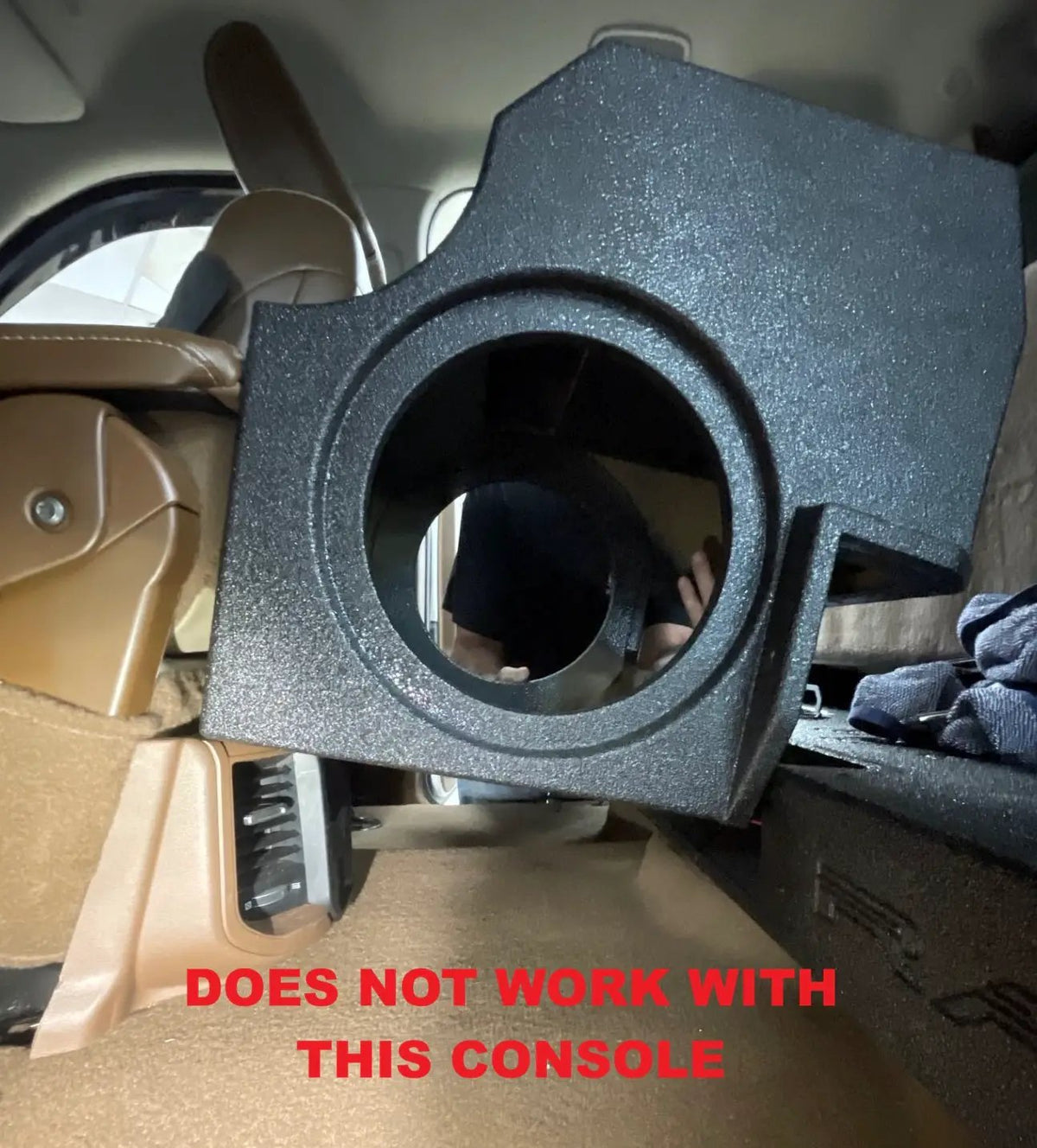 Fitment warning showing a subwoofer enclosure beside a center console labeled as incompatible