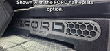 Fox Box enclosure installed beneath a rear seat with the optional FORD nameplate