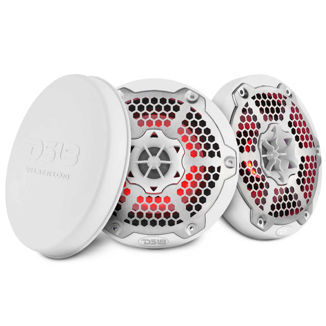 Two white DS18 speakers with silver honeycomb grilles and red lighting beside a white protective cover