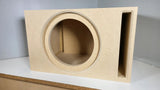 Front view of an empty subwoofer enclosure with a round recessed cutout and vertical slot port