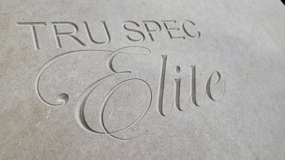 Close-up of the TRU SPEC Elite name engraved into an enclosure panel