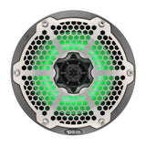 Front view of a carbon-fiber-pattern DS18 speaker with silver honeycomb grille and green illumination