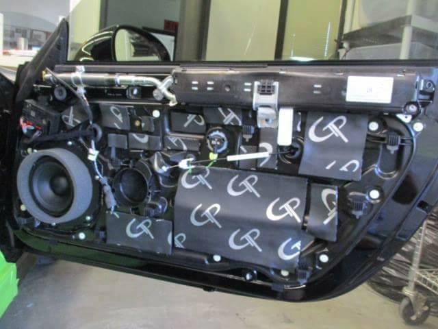 GP sound-deadening sheets applied inside a car door with the trim panel removed